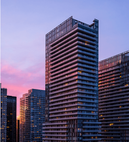 Skyscrapers at sunset with colorful sky.