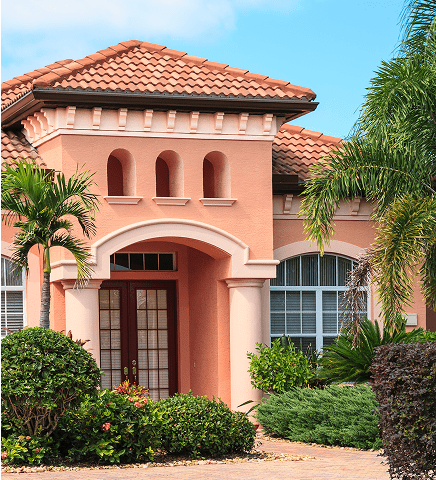Mediterranean-style house with palm trees.