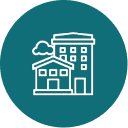 Icon of house and building on teal background.